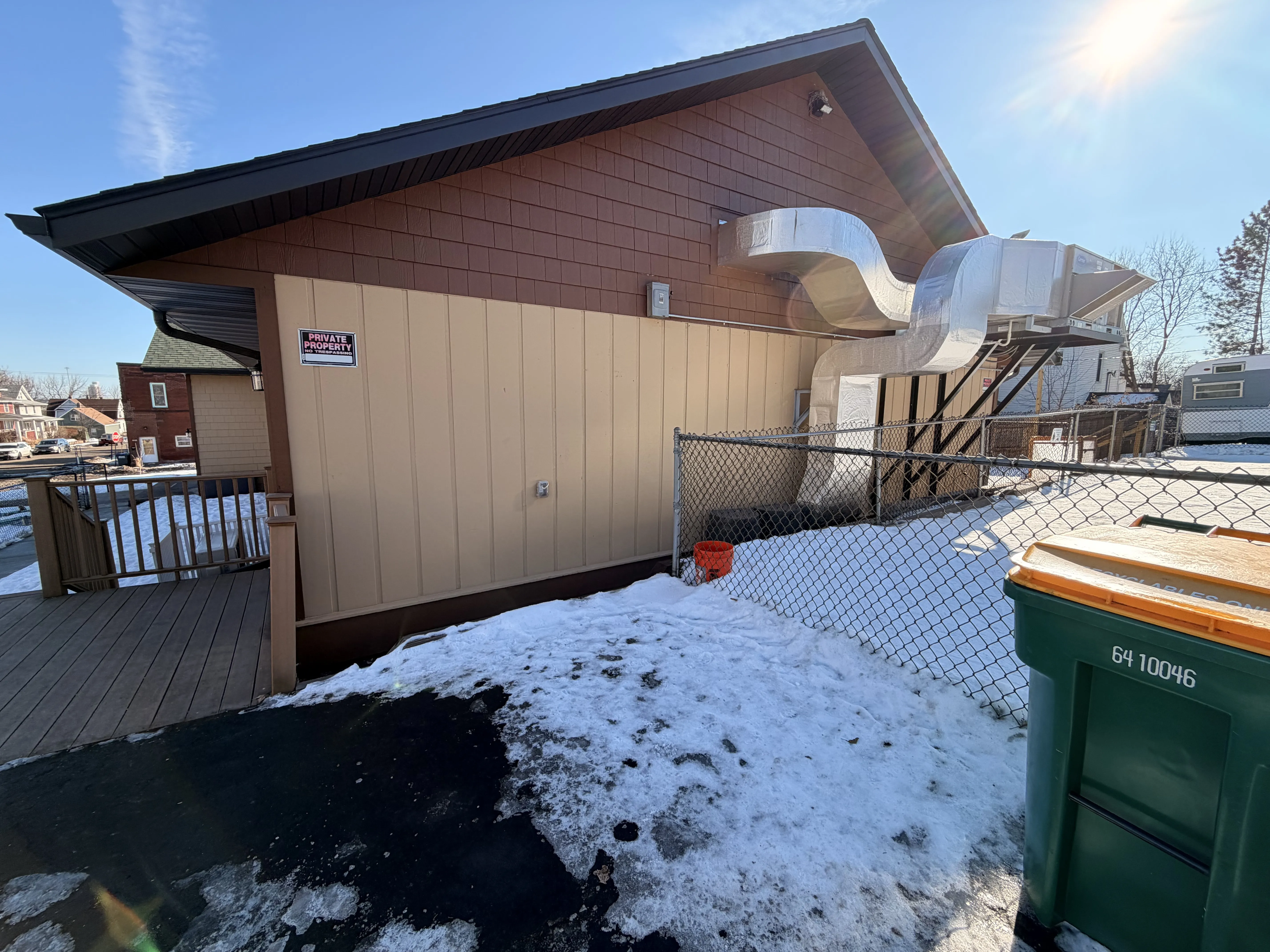 Completed vertical siding installation on a commercial building in the Duluth area
