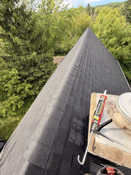 Roof repair work on an asphalt shingle roof