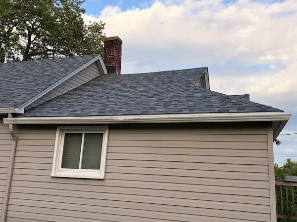 gray shingle roofing project near a residential street in Duluth