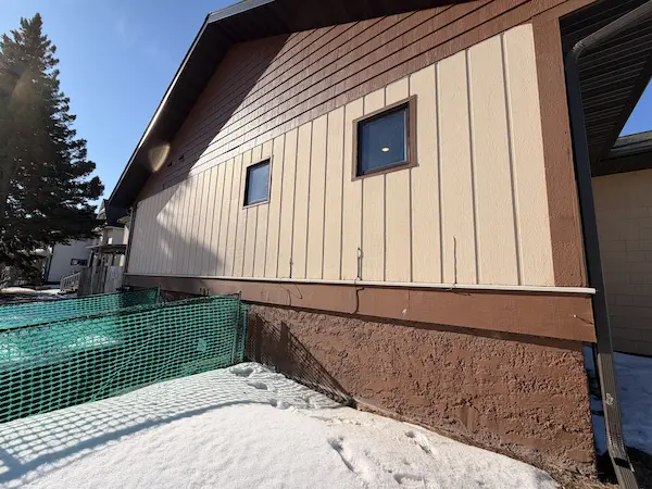 close view of completed vertical siding installation