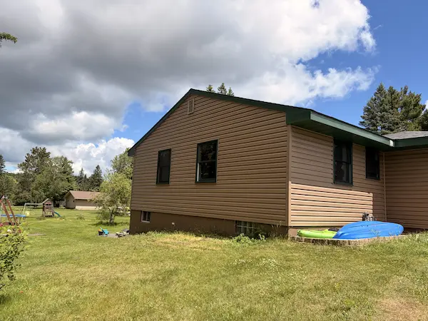 completed siding work on a residential exterior
