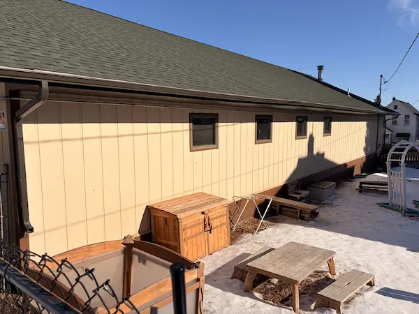 completed vertical siding installation on the side of a commercial building