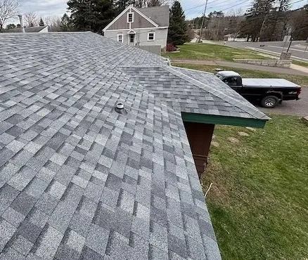 gray shingle roofing project near a residential street in Duluth